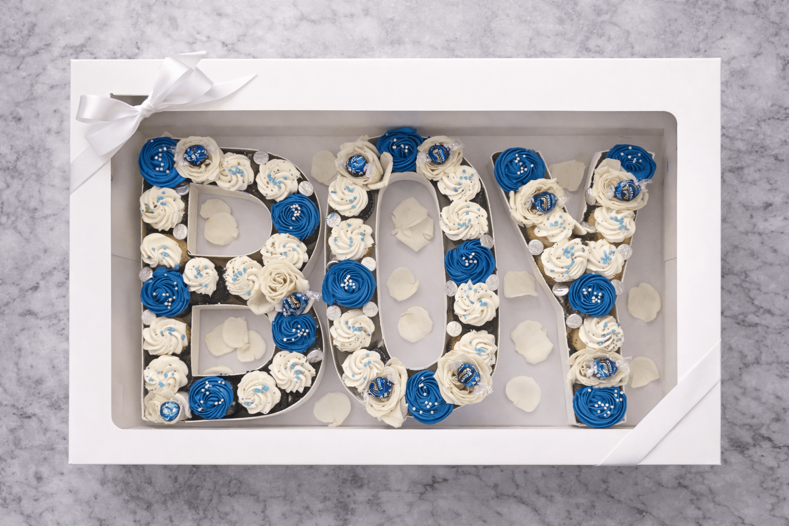 A tray of iced cupcakes