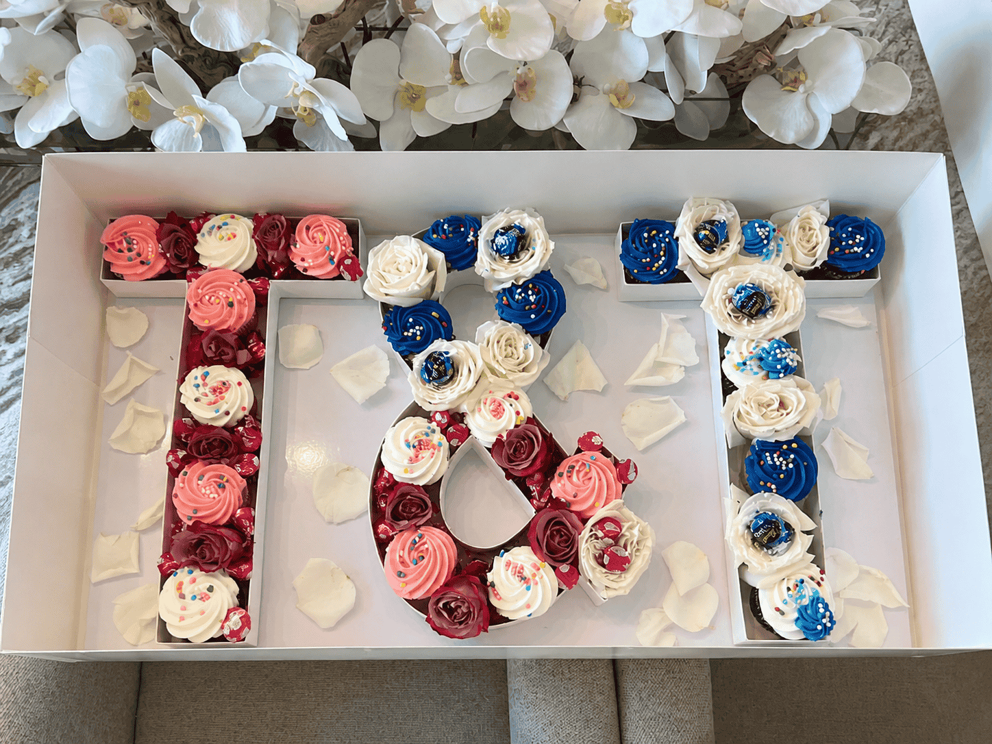 Tray of iced cupcakes