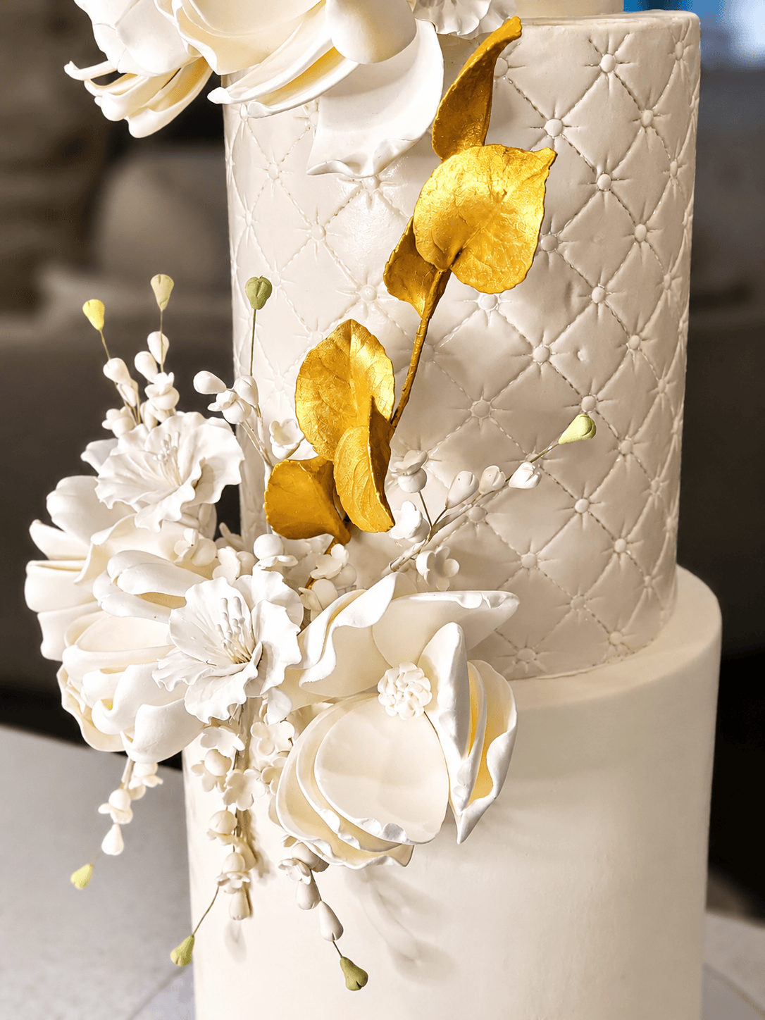 Four tier wedding cake with sugar flowers