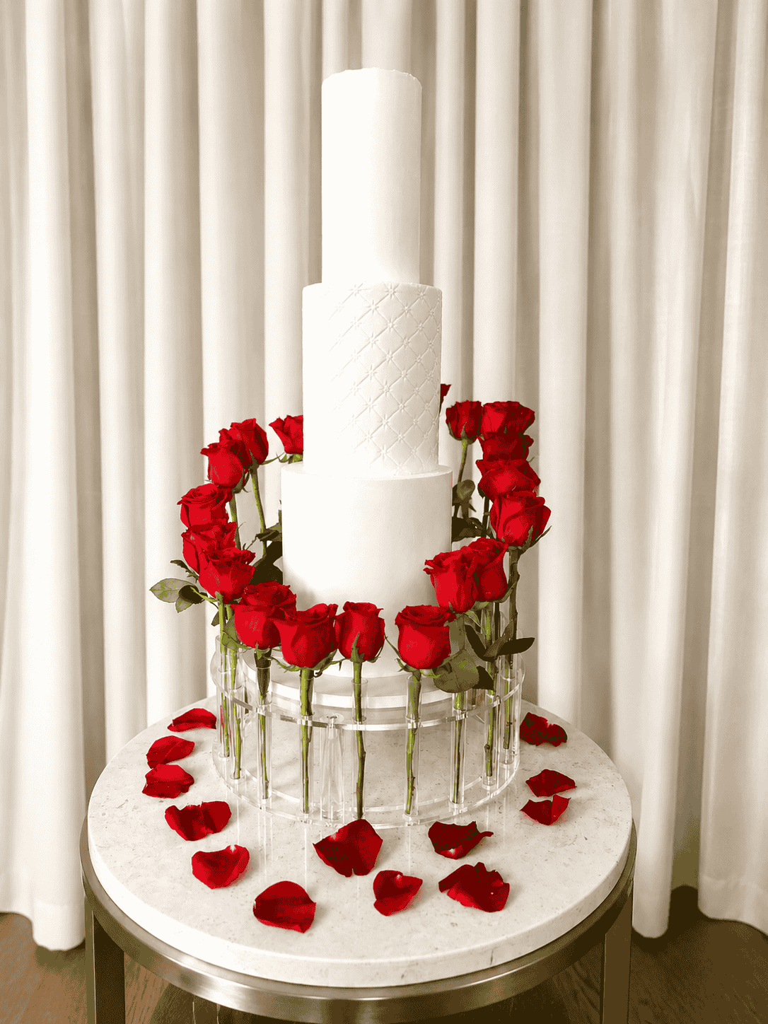 Four tier wedding cake with sugar flowers